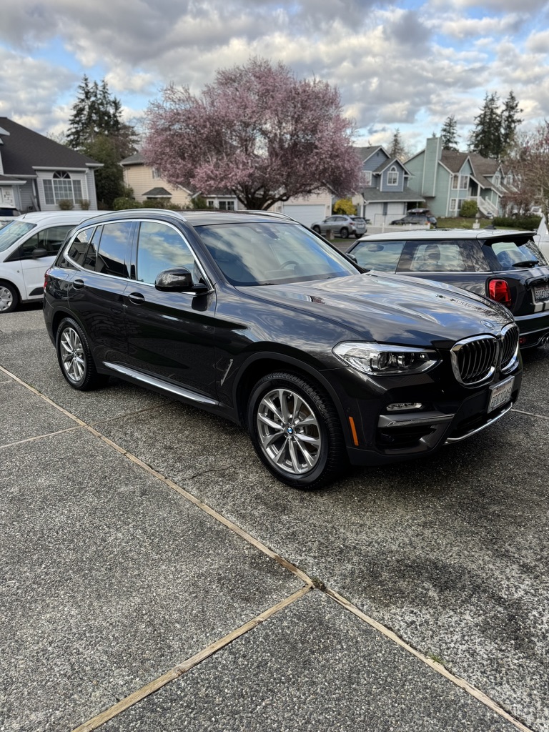 BMW after our exterior hand wash in a Bothell customer's driveway