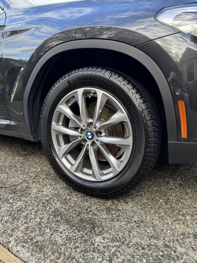 BMW wheel, tire and front fender after an exterior hand wash in Bothell