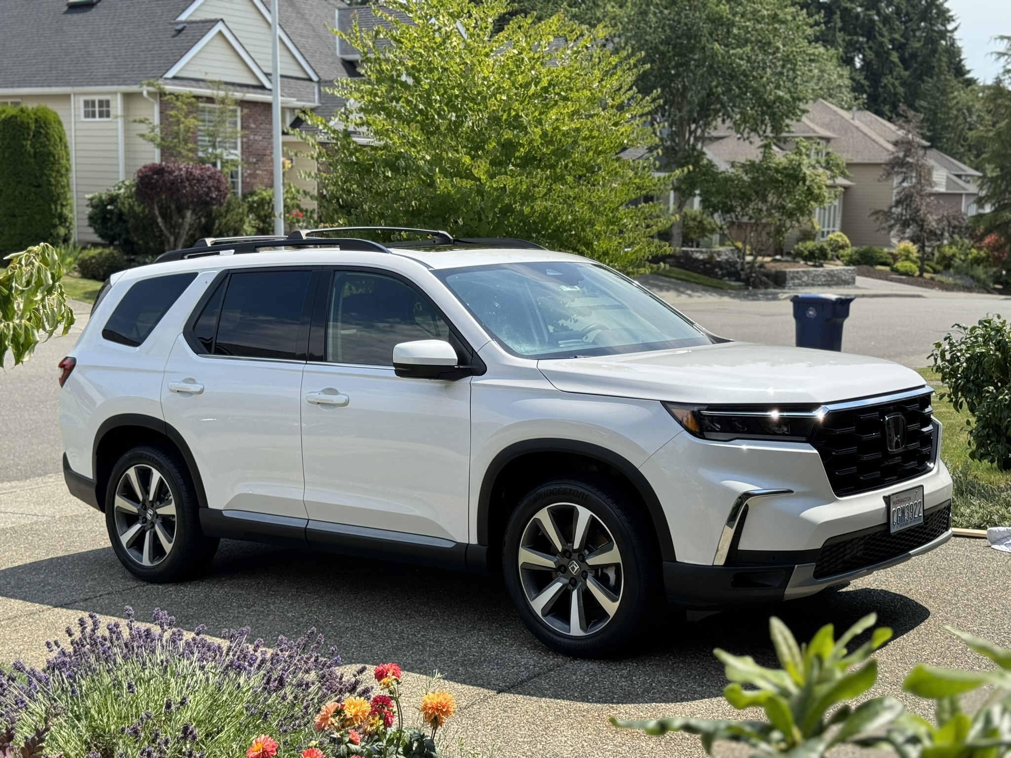 White Honda Pilot after an interior and exterior detail in a Lynnwood driveway