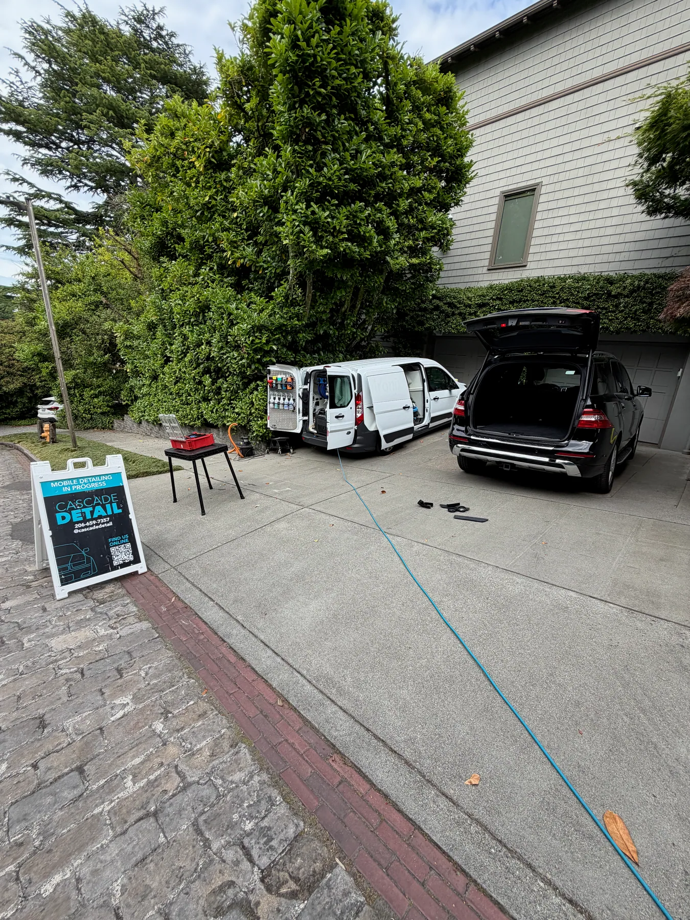 Cascade Detail mobile service setup beside a customer's vehicle